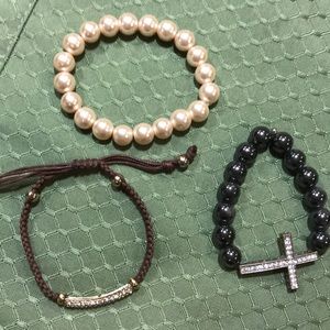 2 beaded bracelets and 1 woven bracelet